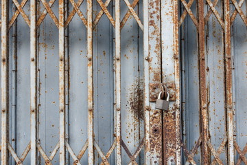 Old rust metal door in old downtown Thailand