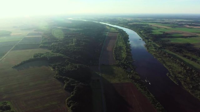 aerial landcape of river in green meadows