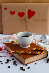 Christmas white background with a book , coffee, gifts and blue