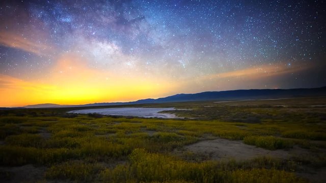 3 axis motion controlled astrophotography time lapse with dolly right & pan right motion of Milky Way galaxy & moon rising over Desert Gold wildflower super bloom 2016 in Carrizo Plain National Monument, California