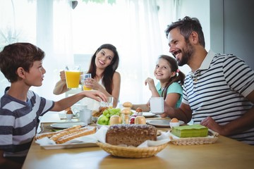 Happy family having breakfast