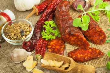 Homemade spicy pepper sausage. Homemade rustic sausages and chili. Sharp traditional food. Traditional butchers. Spicy delicacy. Advertising on butcher.
