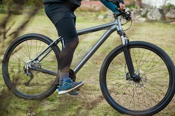 Fototapeta premium Male mountain biker riding bicycle