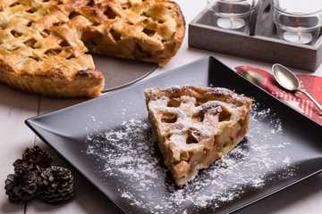 apple pie slice on black plate
