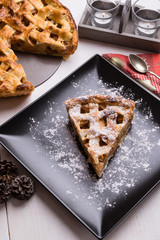apple pie slice on black plate