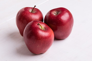 red apple on white table