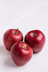 red apple on white table