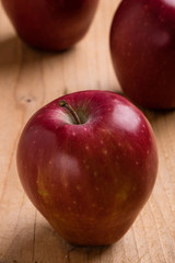 red apple on wooden table