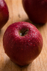 red apple on wooden table