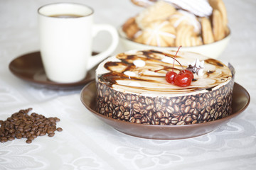 Portrait of a slice of cake with tea and a rose on a table