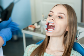 Dentist examining a patient's teeth