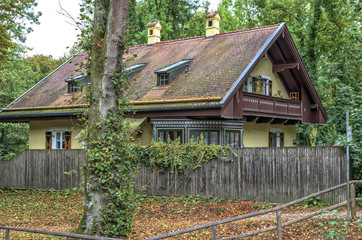 Fototapeta na wymiar Bavarian House.A typical German old family house in Munich by Isar river near Taufkirchen.