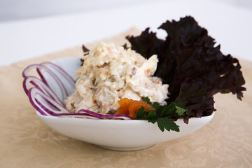 Beautiful tasty salad with lots of gradients on the table red onion greens