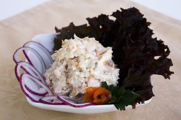 Beautiful tasty salad with lots of gradients on the table red onion greens