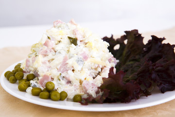 Beautiful tasty salad with lots of gradients on the table red onion greens