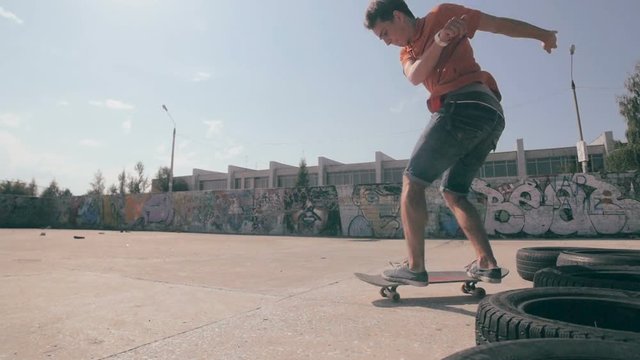 Skateboarders doing tricks during sunset in slowmotion. HD.