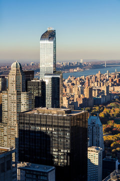 Aerial Autumn view of Midtown and Upper West Side skyscrapers. The view includes Central Park, the Hudson River and the George Washington Bridge