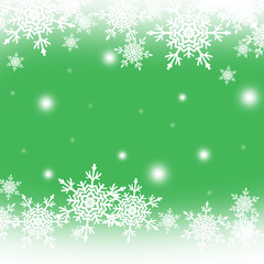 White snowflakes at the green background,christmas pattern with space for text