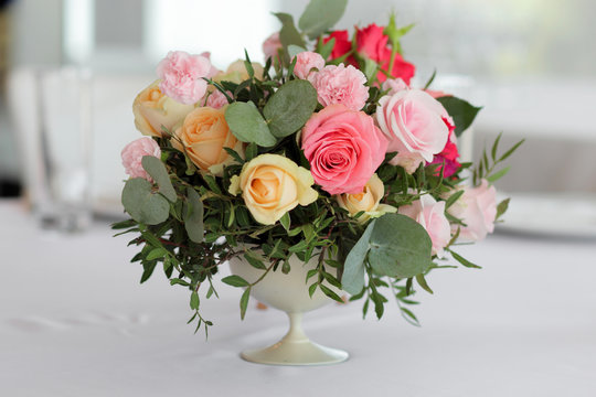 Wedding flowers in a vase on the table, wedding decor