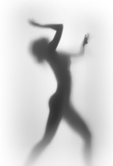 Diffuse silhouette of a beautiful and sexy dancer woman