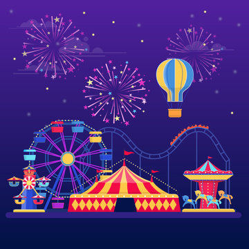 Amusement park at night with fireworks, balloon and rides
