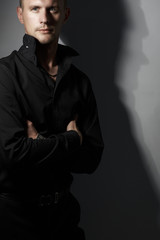 Portrait of handsome man in Studio wearing a black shirt