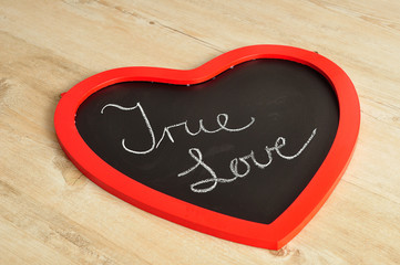 Valentine's Day. A heart shape black board with true love