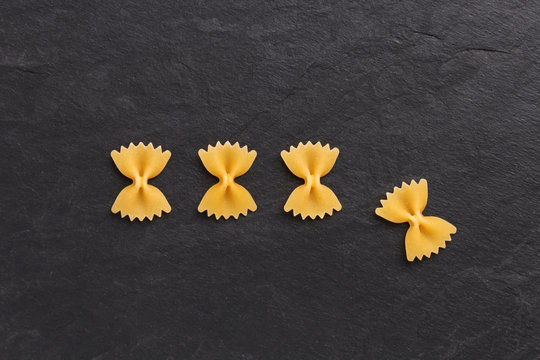 Farfalle pasta on black background