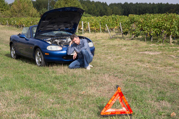 Motorist broken down on country road waiting for help