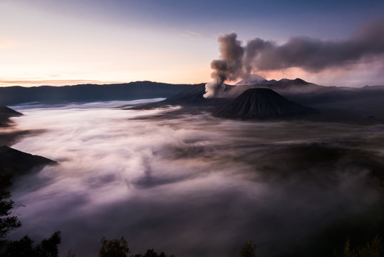 Fog and volcanic smoke spreading over the water (Bohorok, Indonesia)