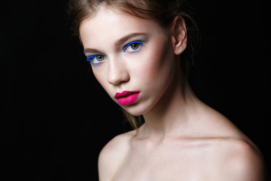 girl with pink lips on black background
