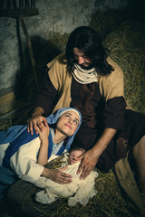 Tired parents in christmas nativity scene