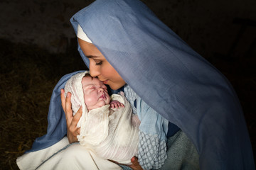 Mary kissing baby Jesus