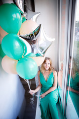 Portrait of a beautiful woman in a green dress
