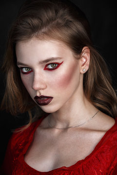a girl vampire on a black background
