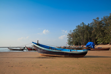 Naklejka na ściany i meble A long tail boat sits in phuket, Phuket, Thailand.