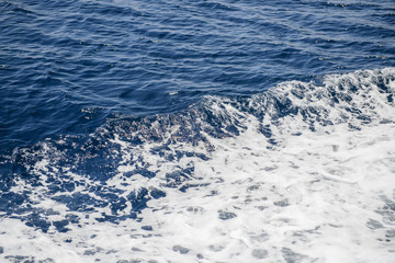 Naklejka na ściany i meble Sea wave close up. Blue sea water background, texture