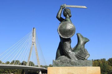 Warsaw, Mermaid statue and Swietokrzyski bridge across the Vistula river - 123050254