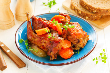Baked rabbit with vegetables.