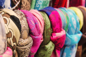 Colorful decorative scarves and shawles at the street souvenir market