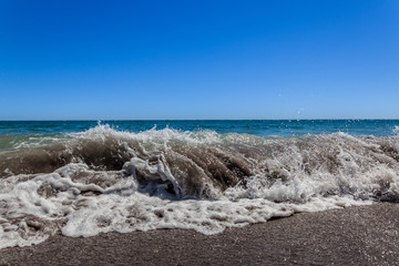 Fototapeta na wymiar A wave comming to the bay of plenty in New Zealand