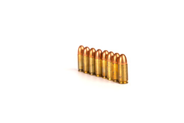 9mm.bullets 8 shots abreast oneline on white background