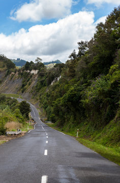 A One Lane Road Down The Hill In New Zealand