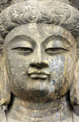   Stone old statue of a Buddha. Face close up , Face Buddha stat