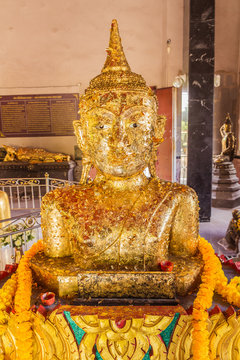 Phuket, Thailand - Sept 12, 2015: Strange Buddha statue at Pratong temple or Phra-phud temple. it is Buddha statue appear up from ground with half body. it is well-known destination for many tourists