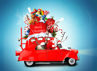 Santa Claus with reindeer in a car with gifts