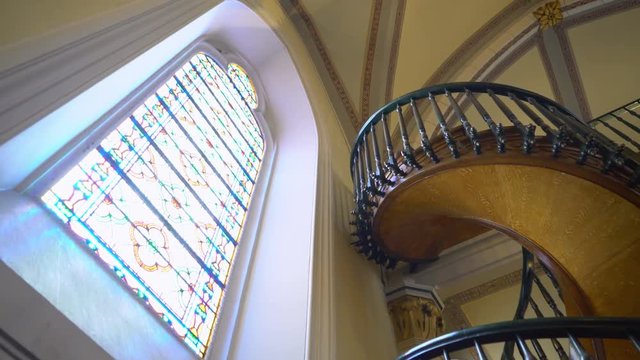 Tracking Shot of Loretto Chapel Staircase in Santa Fe, New Mexico -Tilt Down-