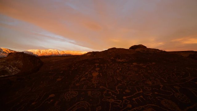 Time lapse of morning glow over Native American Petroglyphs in Eastern Sierra, California