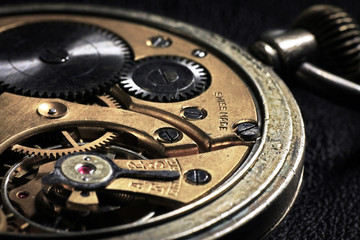 Pocket watch inside with wheels and springs close up