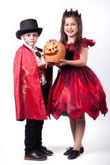 a boy and a girl vampire witch on a white background